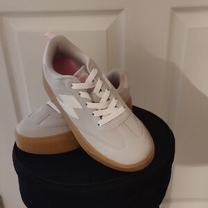 Justice White and Pink Athletic Shoes